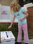 Child casting a ballot